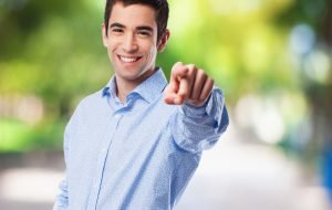 cool young-man pointing to front